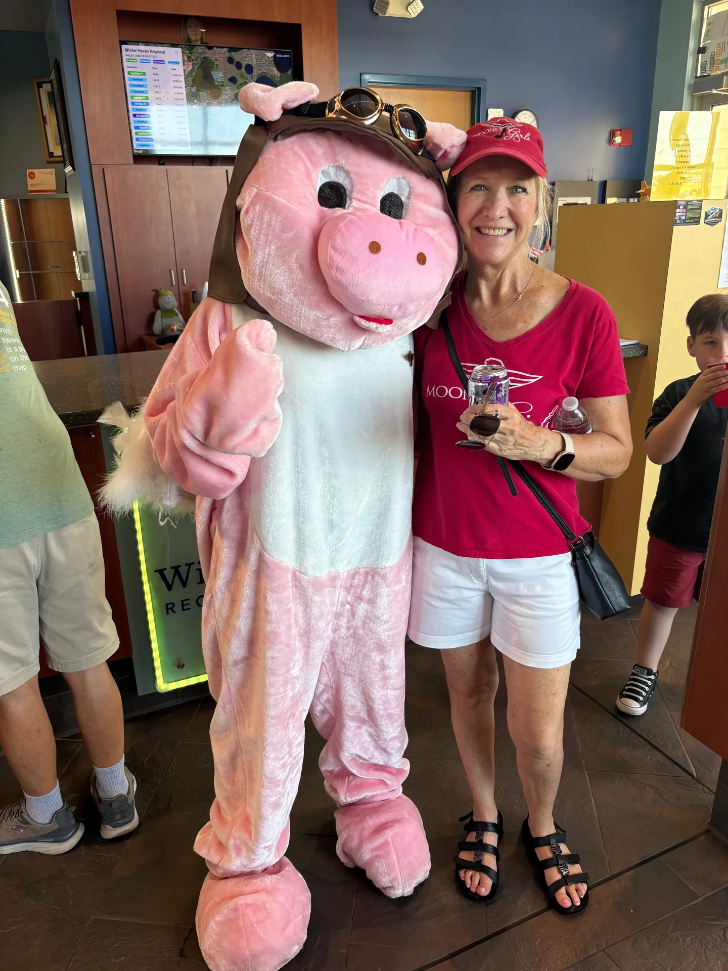 A chapter member poses with the flight school mascot