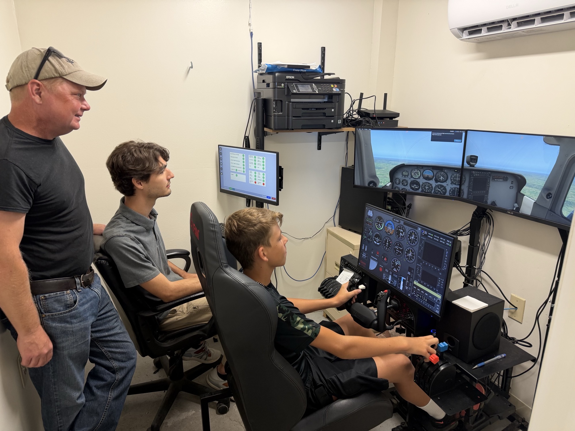 Young visitor flying the FAA-approved Gleim Flight Experience BATD flight simulator at EAA Chapter 229