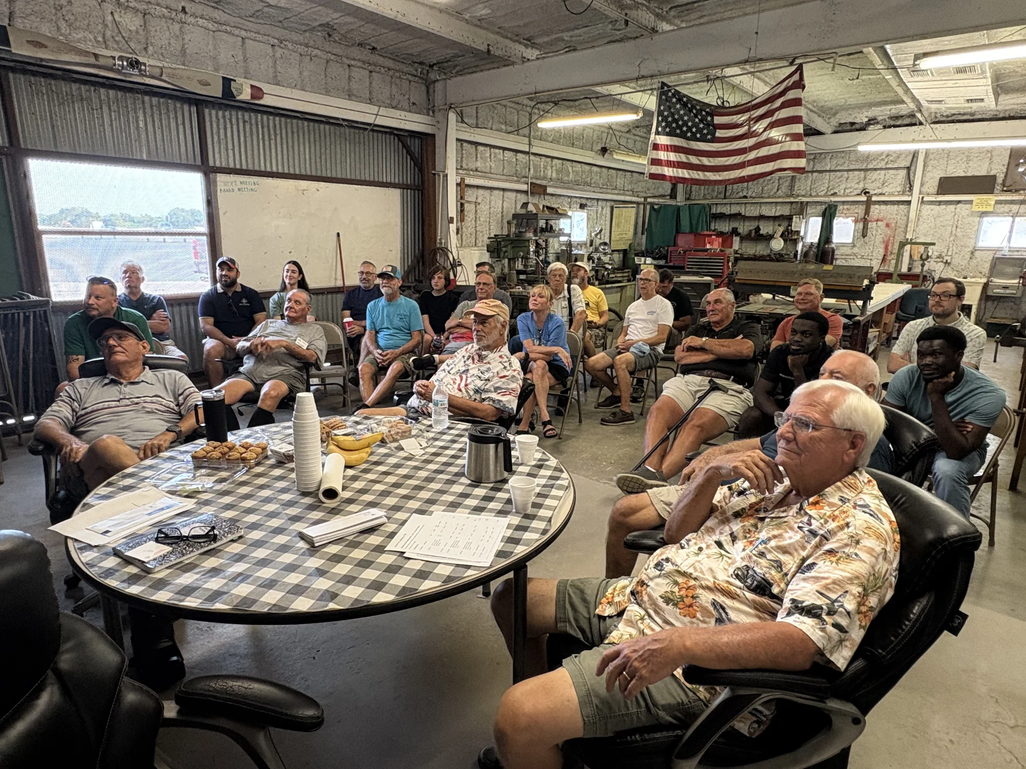Members watching the slideshow at the October 3 meeting in Hangar 100